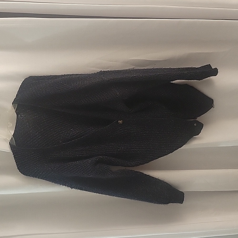 Dark sweater with brown buttons